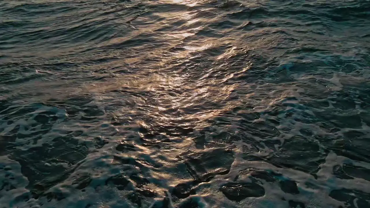 Smooth ocean waves during sunset