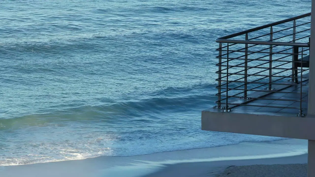 Hotel Balcony with Ocean Waves Meeting The Shoreline Of Beach