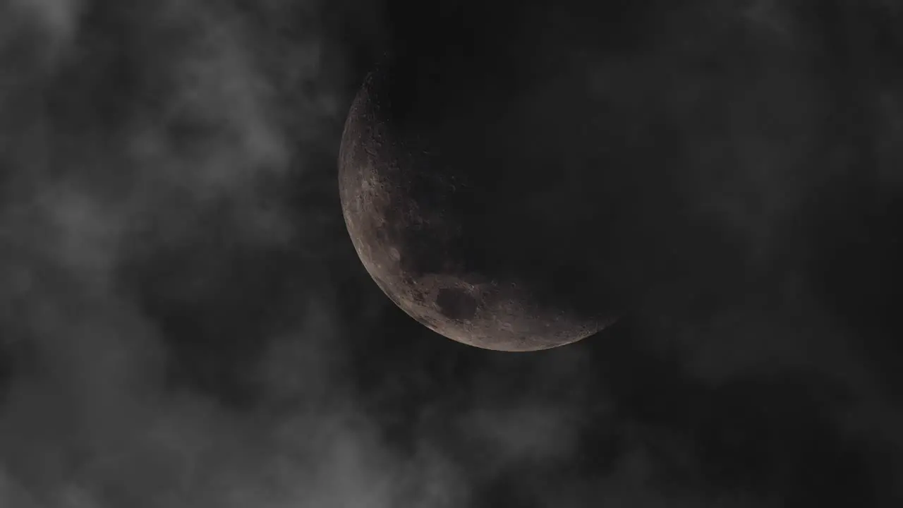 zoom in moon at night with dark clouds all around