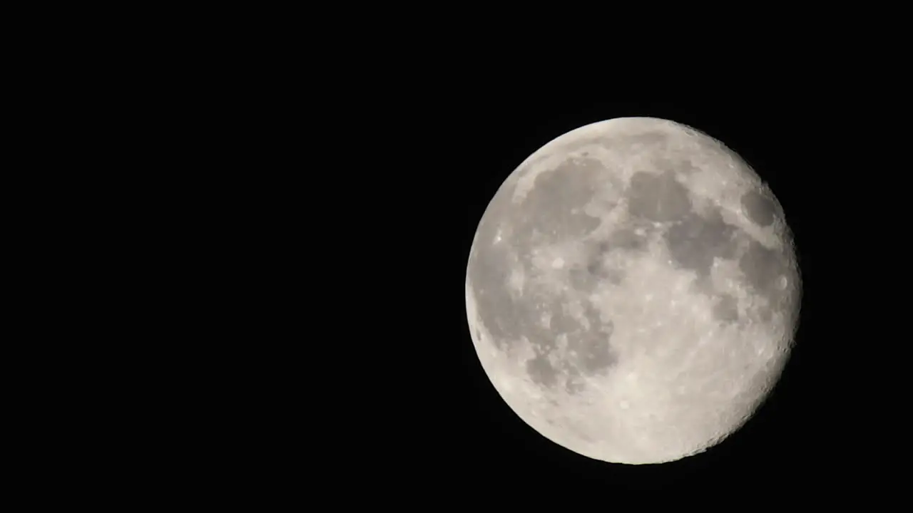 Moon closeup passing by with visible atmosphere flickering speed up 6 times