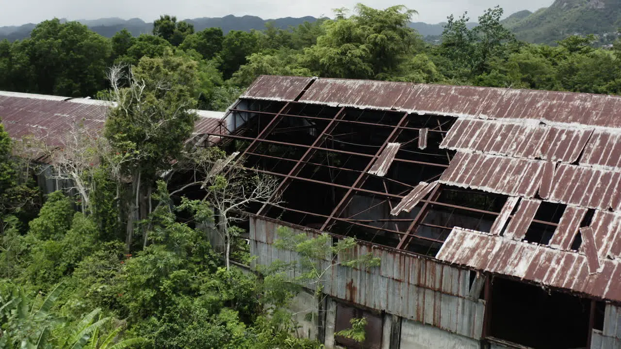 Aerial view over an old abandoned factory in the heart of the jungle hideout and drug smuggler type concepts