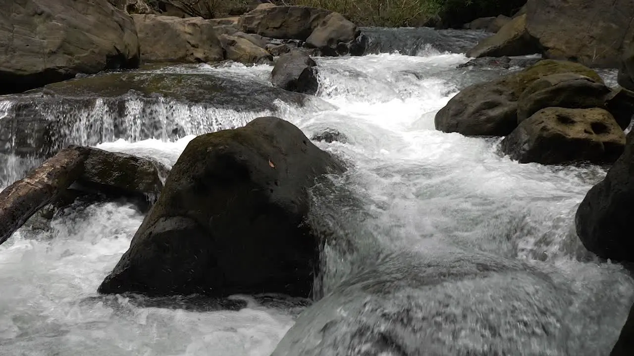 Water rapids in the river gushing at high speed