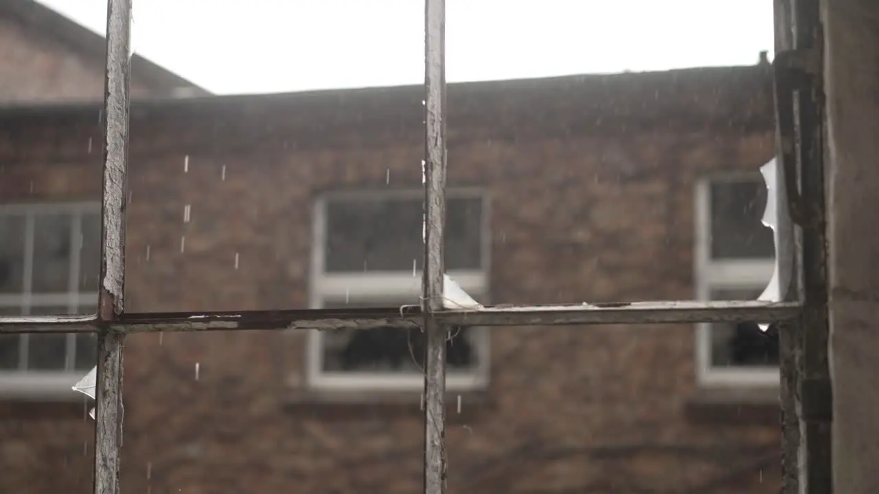 Abandoned old building rain falling through old broken window panes