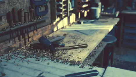 Retro stylized old tools on wooden table in a joinery