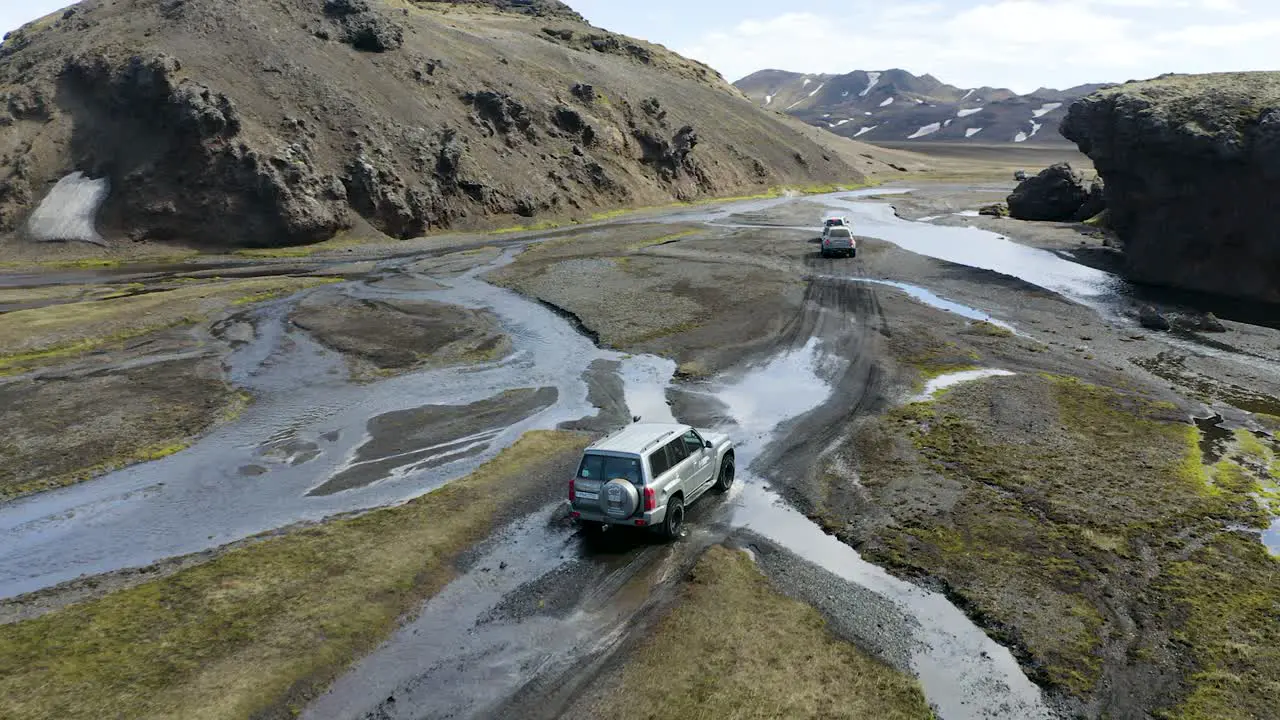 A drone video following a group of 4x4 trucks in the highlands of Iceland