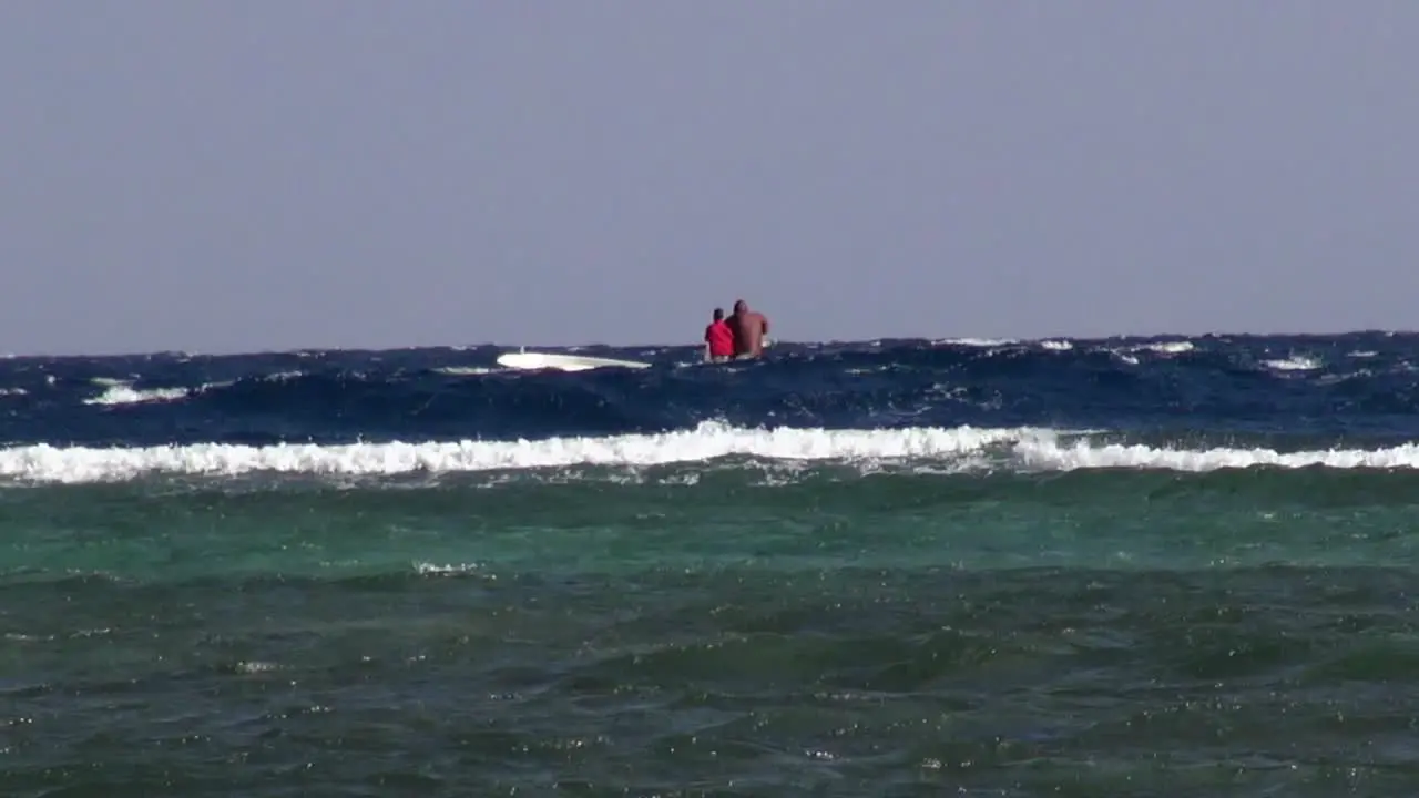 Boat in waves just beyond the reef