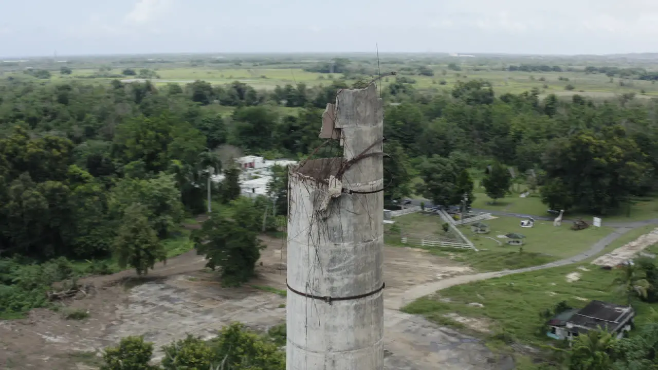 Aerial close-up of the chimney stack at an old abandoned factory in Puerto Rico