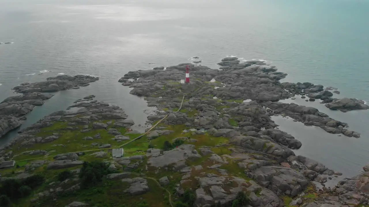 drone flies over lighthouse on norwegian south coast Eigeroy Fyr