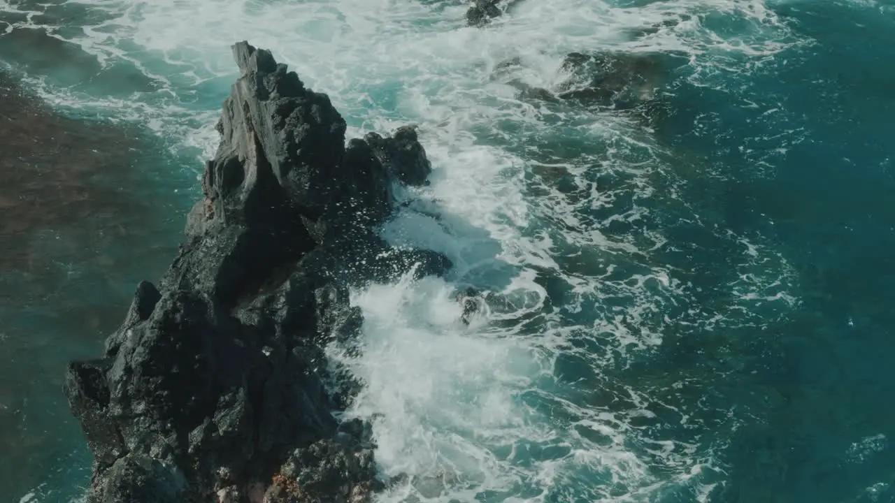 Water splapping against rock in slow motion