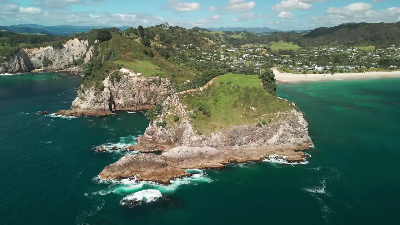 Rough sea waters crashing onto rocky cliffs