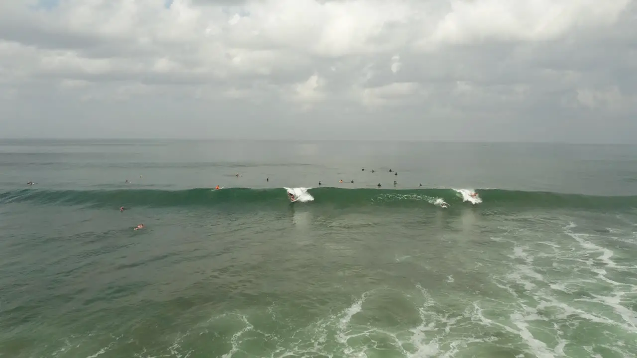 Aerial View of Surfers in Indian Ocean Surfing and Waiting For Waves Bali Indonesia