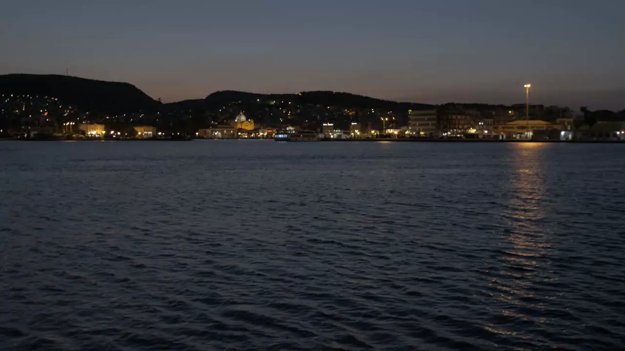 Pan up revealing Mytilene city at dusk wide shot