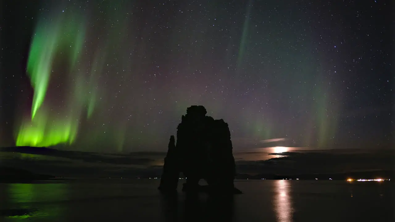 Time Lapse of Northern Lights above Hvítserkur Iceland with Moonrise