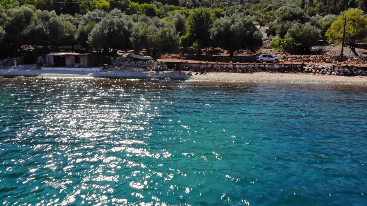 Turquoise Ocean At Agia Sofia Beach In Greece aerial pullback