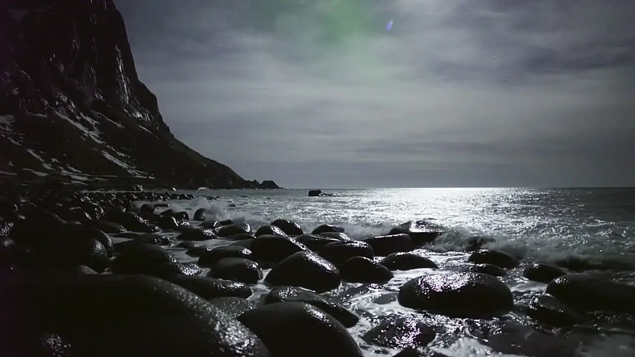 Gloomy Atmosphere At Uttakleiv Beach With Waves Rolling Over Rocks In Lofoten Islands Norway