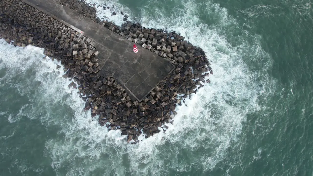 Waves crashing at the ocean shore aerial