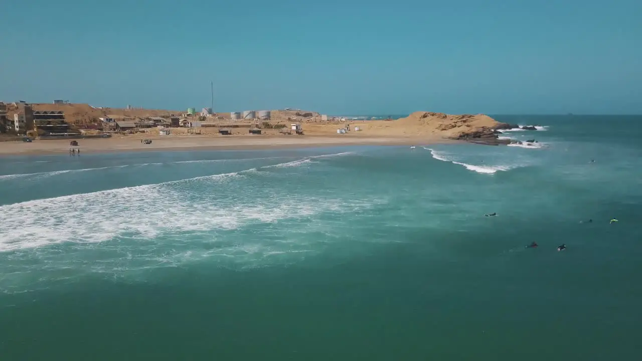 Surfer Riding Ocean Wave In Lobitos Peru On A Sunny Summer Day