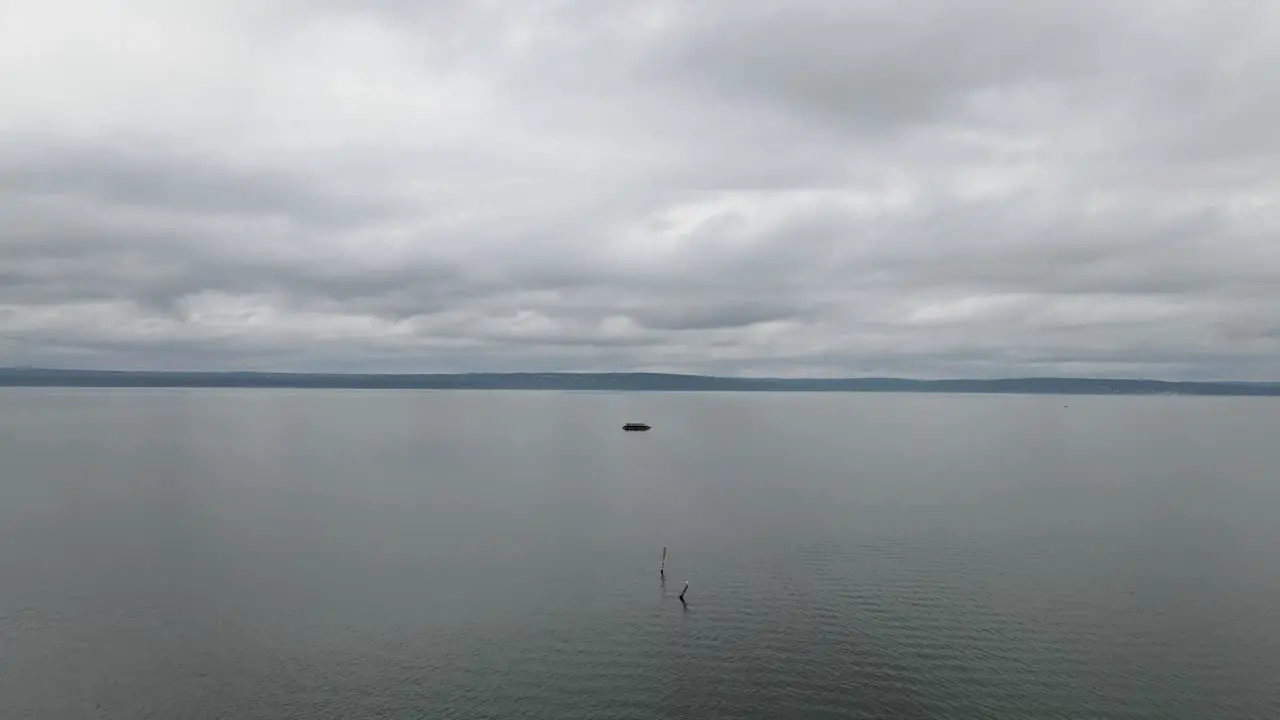 Aerial view of a empty wooden pier in the middle of the ocean