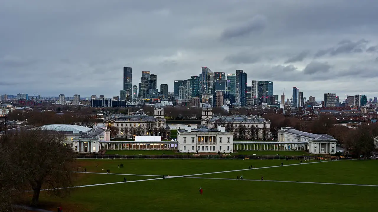 London skyline day to night timelapse overlooking the famous Greenwich Old Royal Naval College with the modern skyline of Canary Wharf in Docklands behind