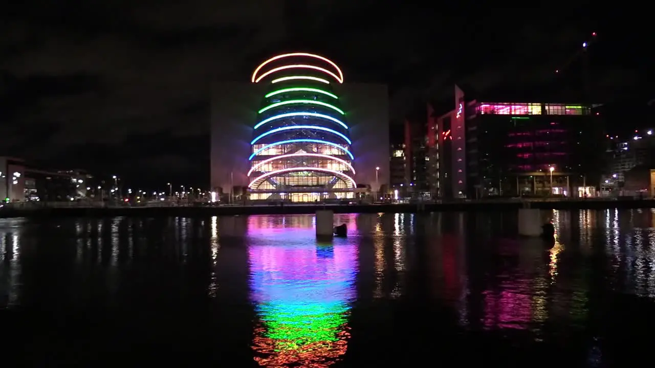 Still shot of Dublin Convention Centre with vehicles and clouds pass by and night time