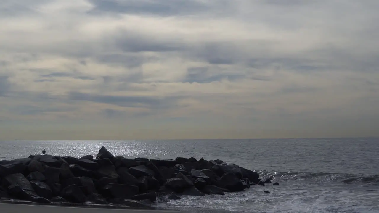 The beautiful waters of the Santa Monica Beach in California on a cloudy day Wide shot