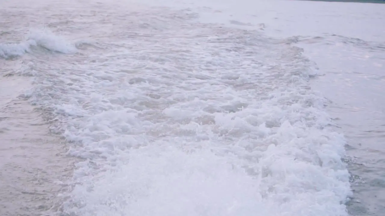 The propeller wake water blasting from the rear of a giant motorboat