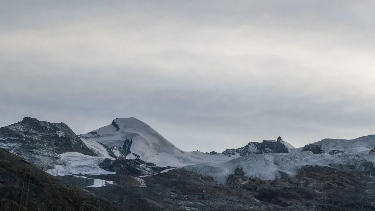 Cinematic Switzerland Saas Fee ski Resort village Glacier Gletscher Swiss cloudy afternoon dusk sunset end of summer time lapse peak stunning mountain peaks near Zermatt matterhorn still movement