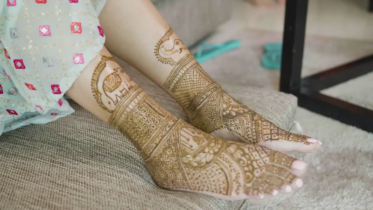 Mehndi Art On The Bride's Legs During The