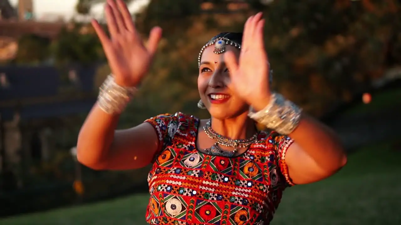 Woman Dancing Classical Traditional Indian Dance In A Garden In Sydney Australia medium shot