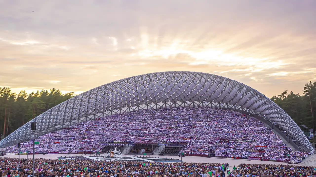 Timelapse of the Latvian song and dance festival People sitting in the stadium