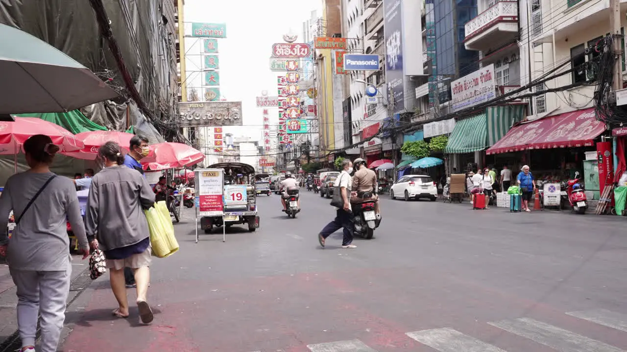 Police on Motorcycle Riding in the Streets in Chinatown in Bangkok Thailand