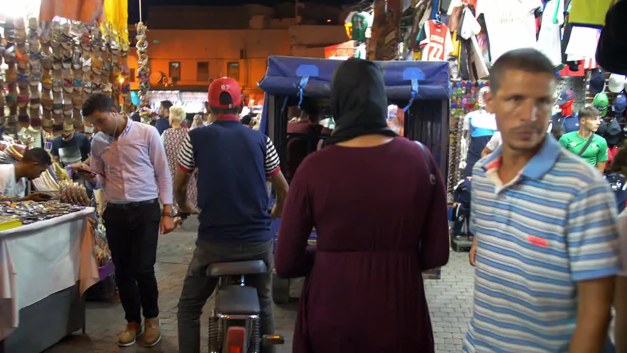 Walking through night markets in Marrakesh Morocco exploring the local culture busy crowds with lots of people