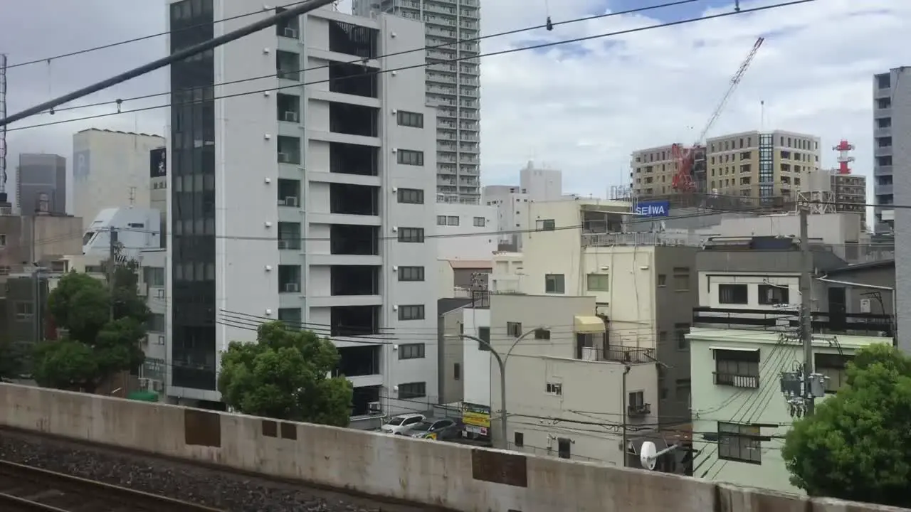 view from moving train in Osaka Japan