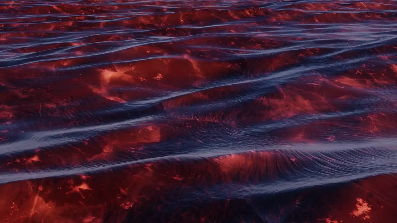 Deep dark red colored sediment underneath slightly turbulent ocean waves at sunrise seamless loop