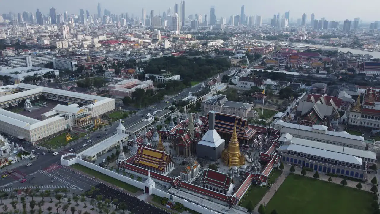 The two different sites of Bangkok in front the traditional temples of the grand palace and in the background the modern skyscrapers