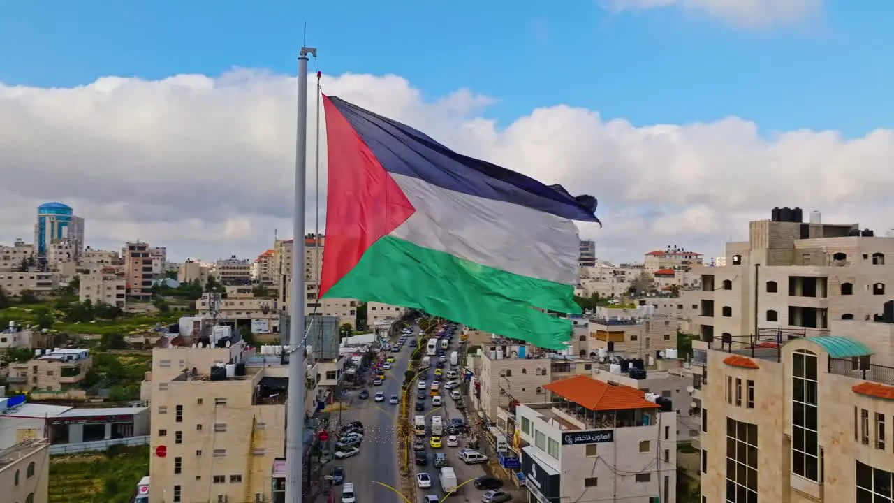 Vintage National Flag Waving Over Hebron Cityscape In Southern West Bank Palestine