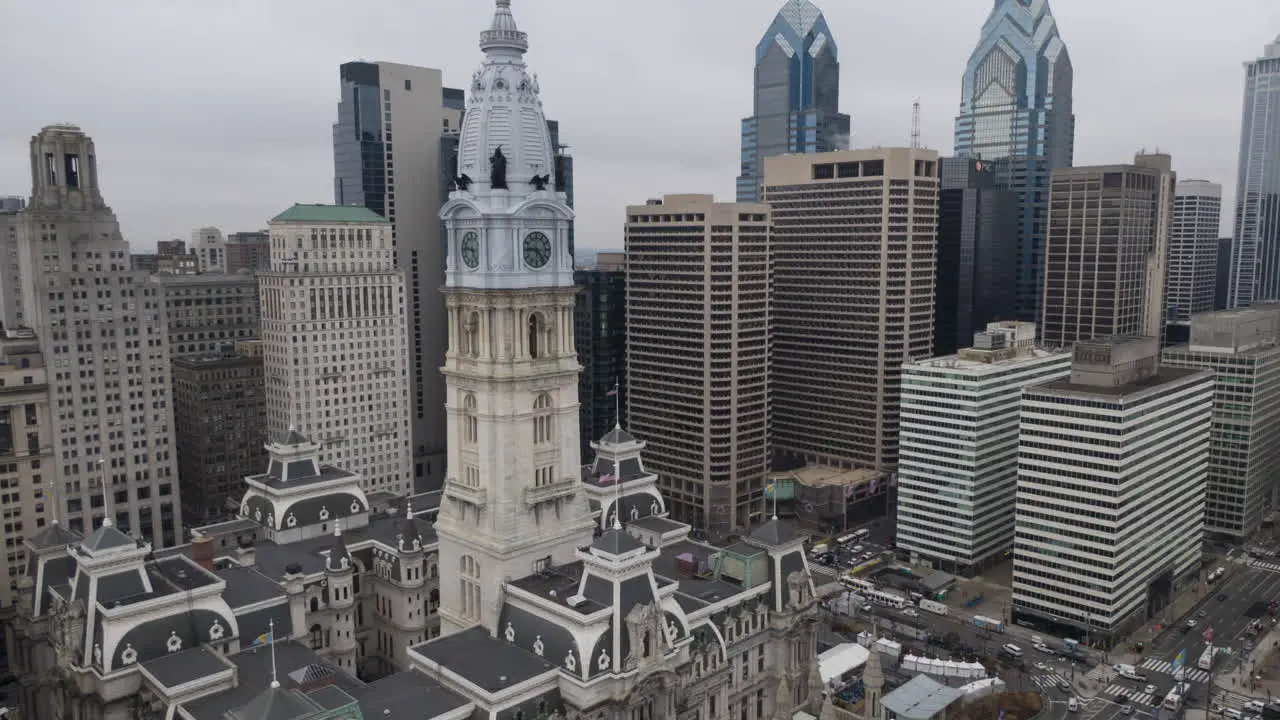 Philadelphia City Hall and skyline aerial hyper lapse of downtown area tilt down on streets and traffic