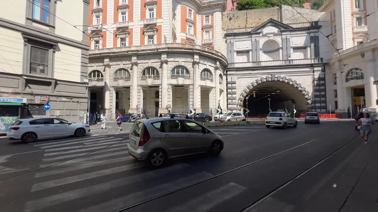 Traffic at city intersection near tunnel entrance urban architecture Neapol italy