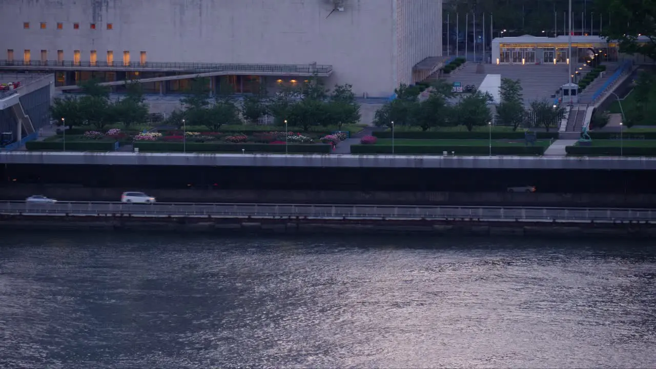 Traffic on FDR Drive by the shore of East River at the United Nations Building on a summer afternoon Manhattan New York City