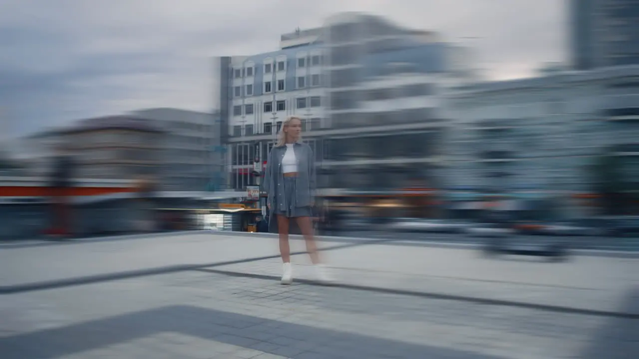 Woman posing city landscape at evening street in urban background