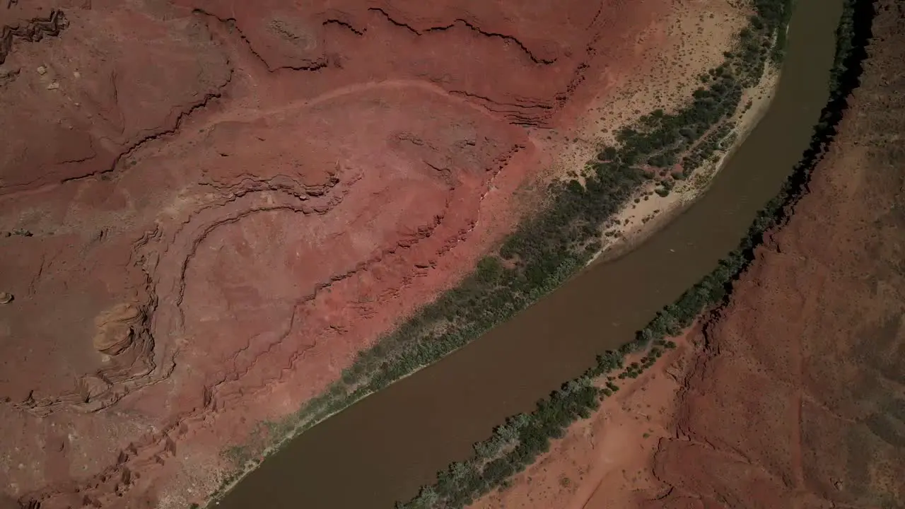 An aerial video featuring the Colorado River flanked by the abstract patterns of Antelope Dunes on either side