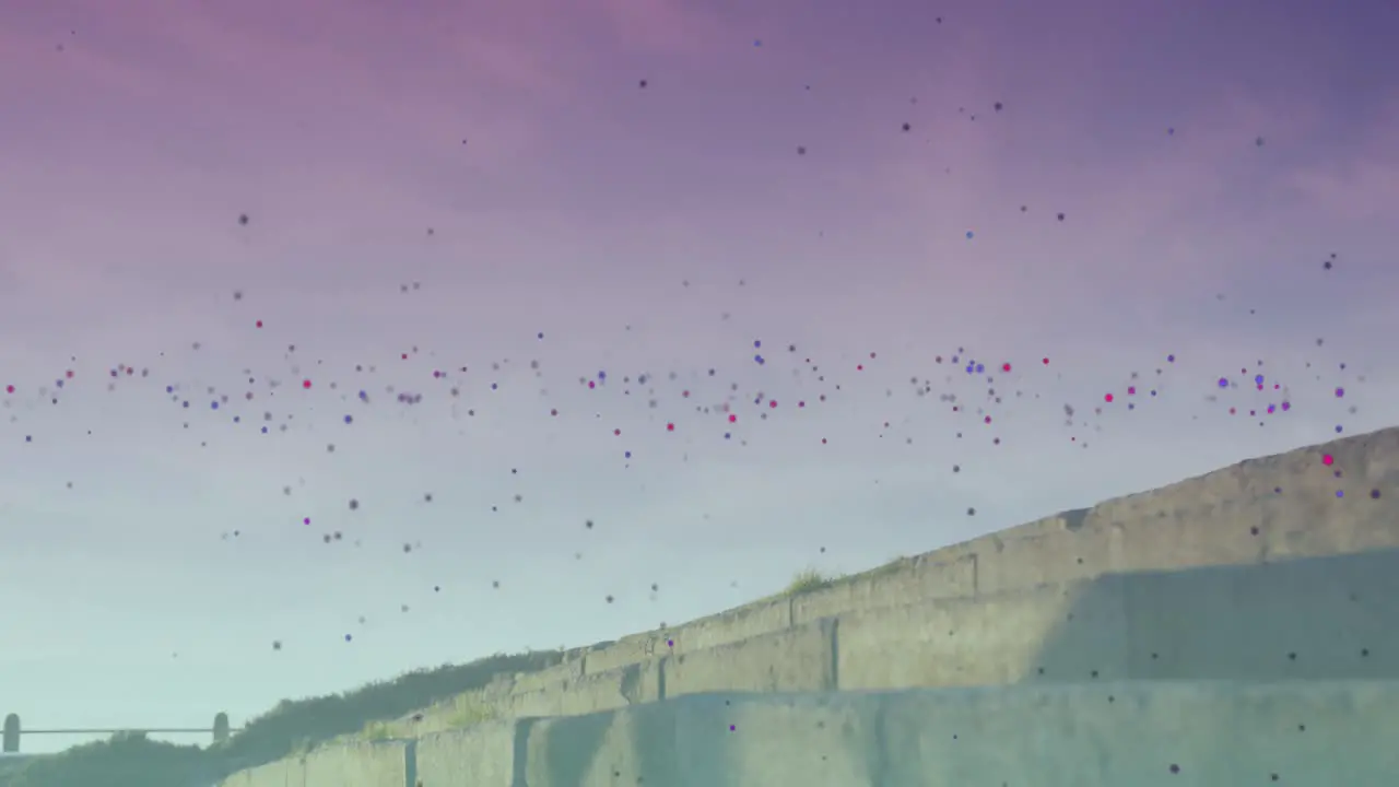 Colorful spots floating against african american fit woman running up the stairs outdoors