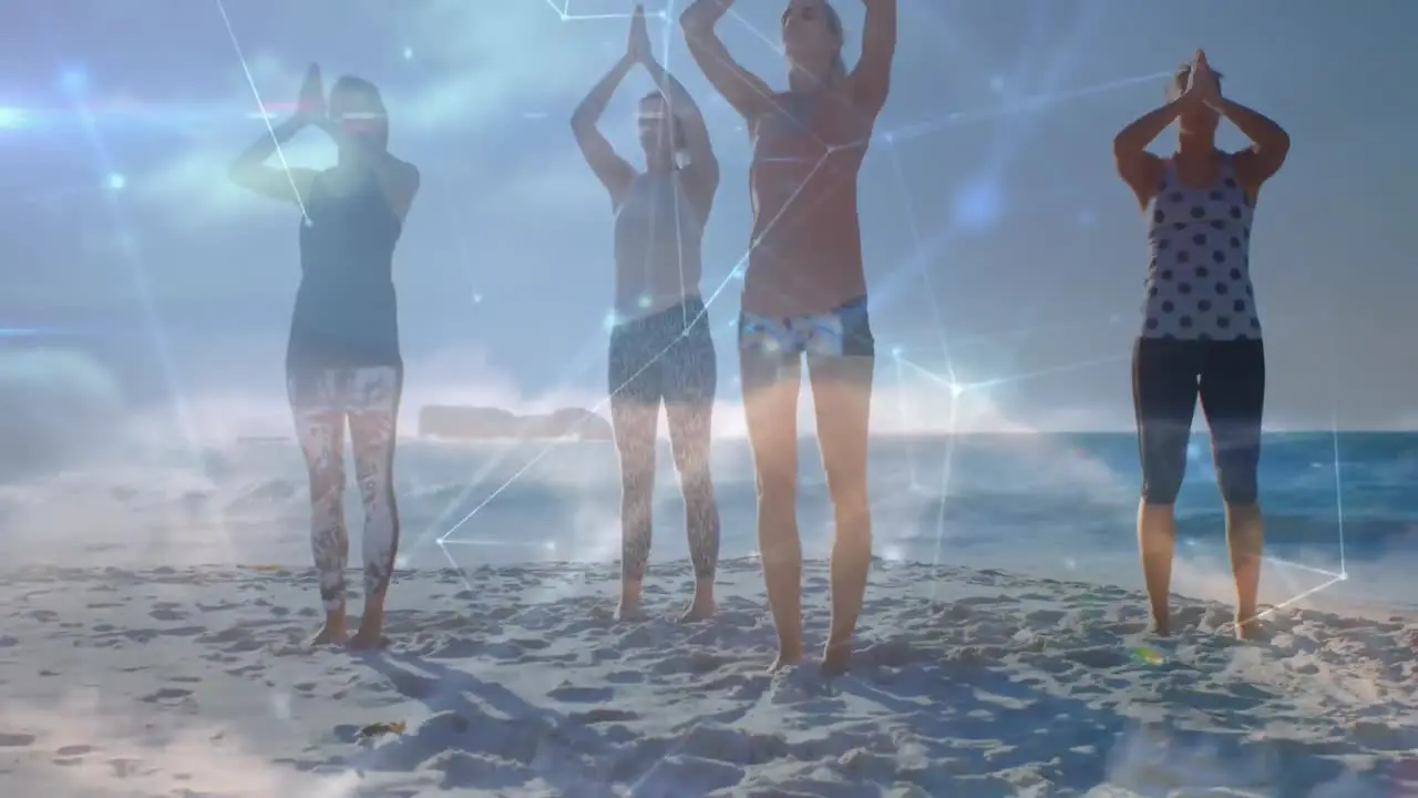 Animation of data processing over group of female friends practicing yoga meditating at the beach