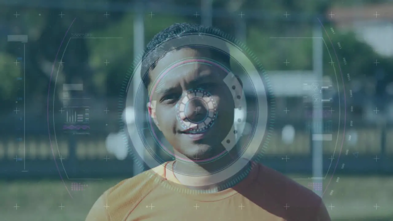 Scope scanning over digital interface with data processing against male soccer player smiling