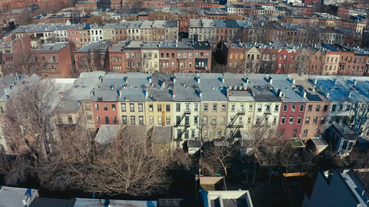 Incredible aerial drone shot of rows Brooklyn New York apartments and tenement buildings