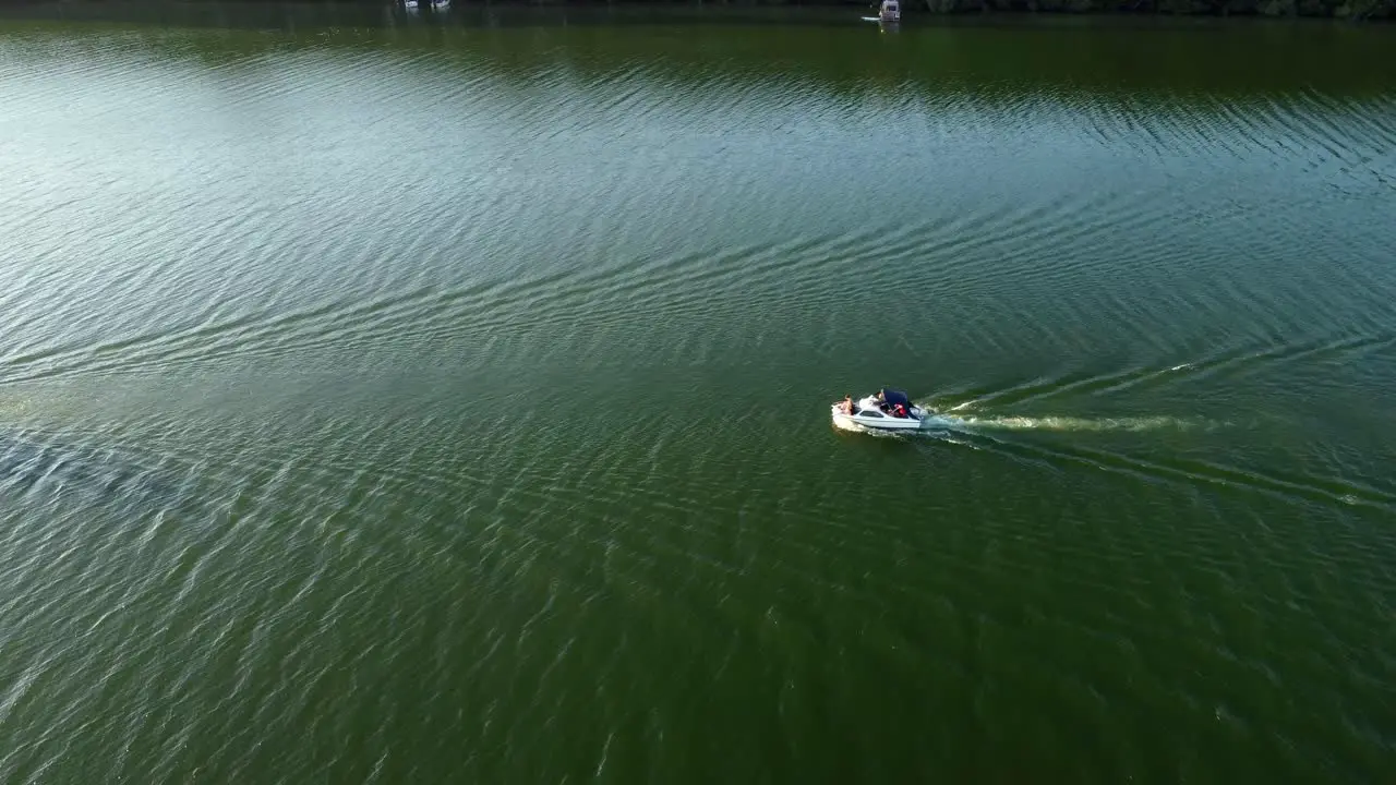 Two sport boats driving on a small lake in Brandenburg Germany