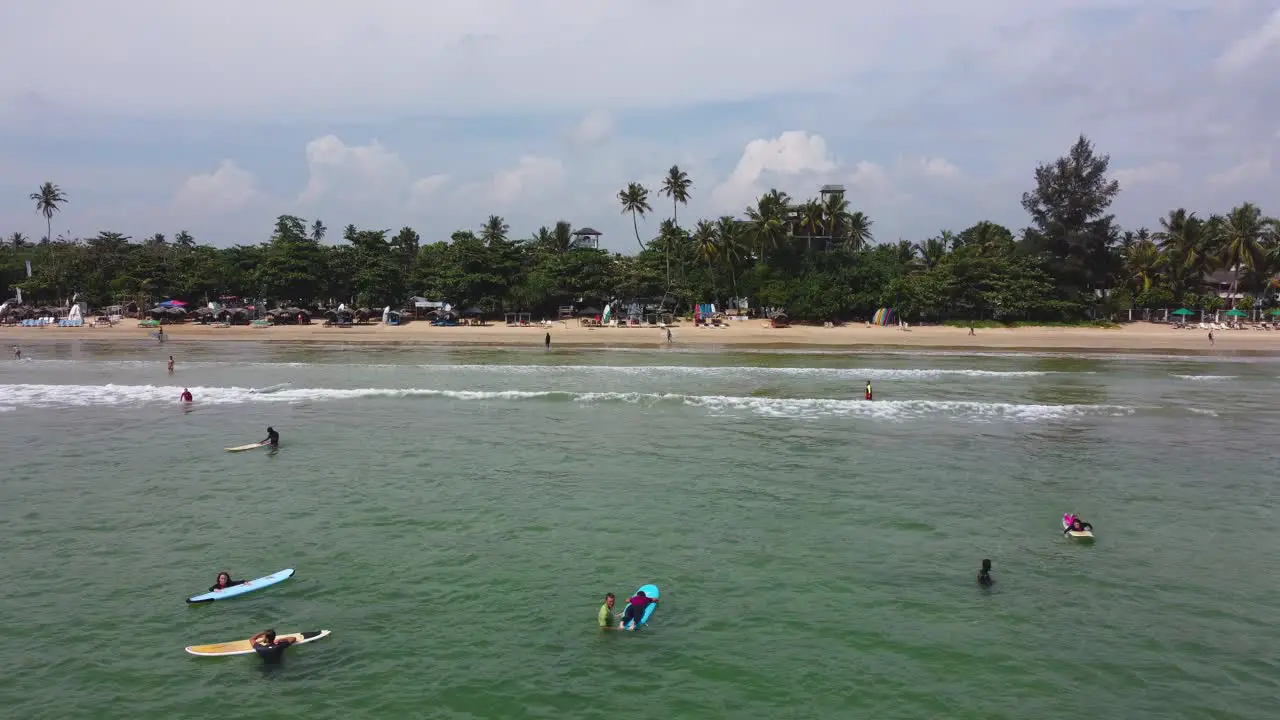 Fixed Shot Of People Surfing At Dazzling Mirissa Tropical Sand Beach Sri Lanka