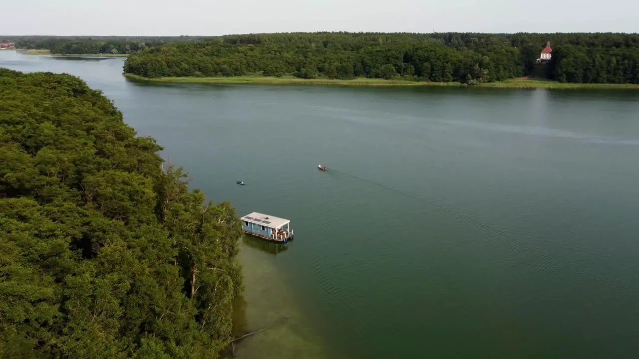 Several boats driving on a large natural lake in Brandenburg Germany