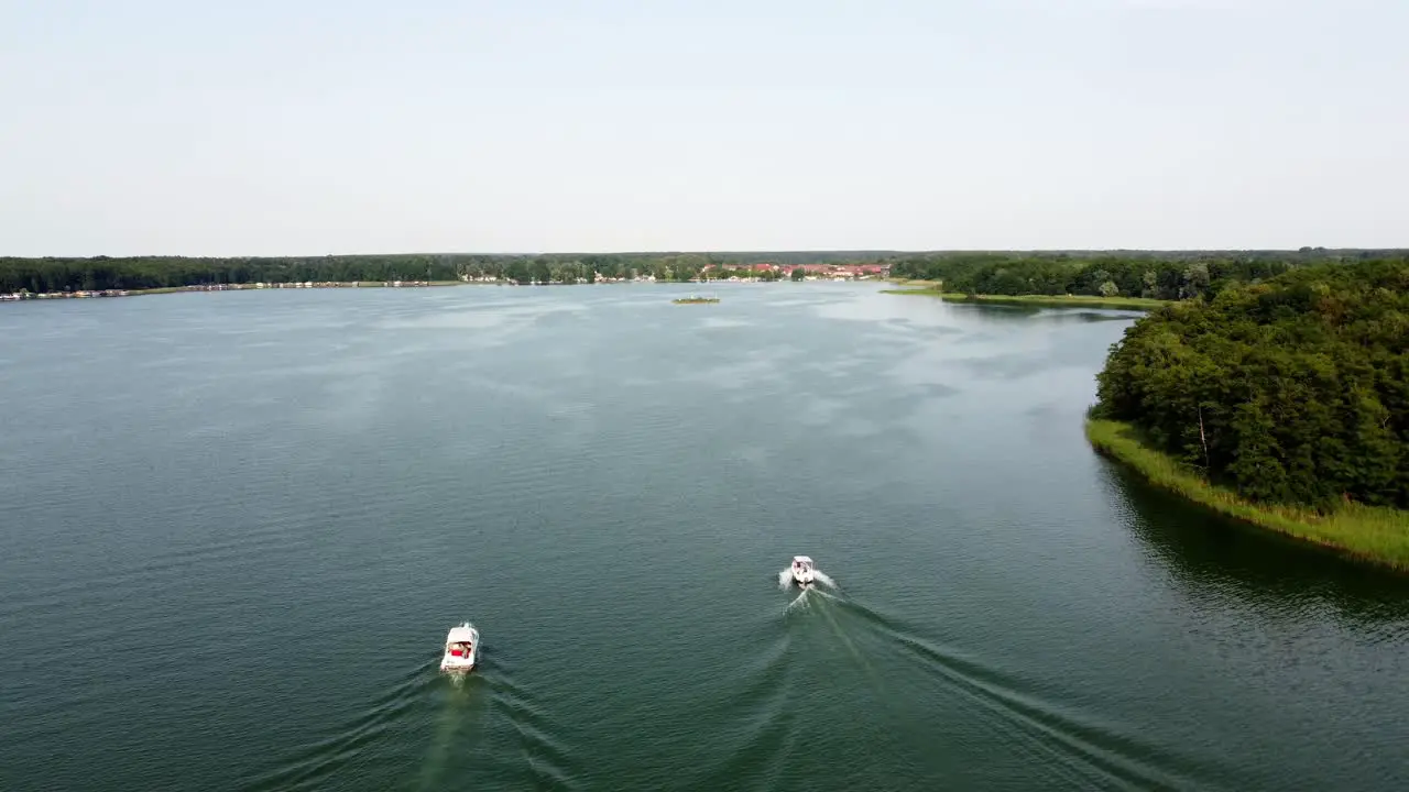 Several motor boats racing on a large lake in Brandenburg Germany