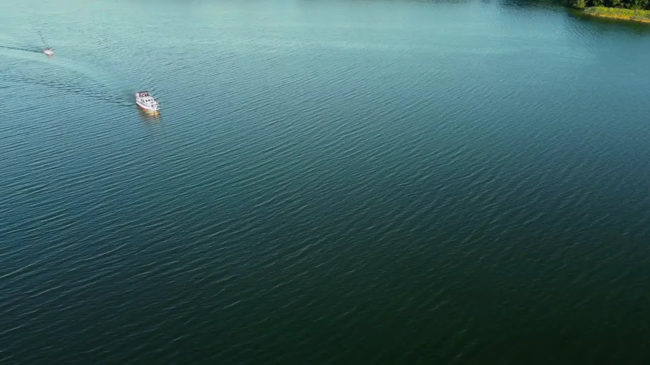 Several motor boats driving on a large natural lake in Brandenburg Germany